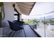 Stylish balcony featuring modern furniture and glass railings with scenic neighborhood views at 5801 E Surrey Dr, Cave Creek, AZ 85331