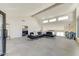Expansive living room with bright light, fireplace, views, and a large sectional couch at 5801 E Surrey Dr, Cave Creek, AZ 85331