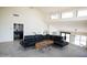 Spacious living area featuring high ceilings, modern tile floors, and a comfortable seating area at 5801 E Surrey Dr, Cave Creek, AZ 85331