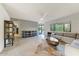 Bright and airy living room with stylish furnishings and an open layout with a large window overlooking the backyard at 5801 E Surrey Dr, Cave Creek, AZ 85331