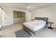 Spacious bedroom with modern furnishings, built-in storage, and a ceiling fan for added comfort at 5801 E Surrey Dr, Cave Creek, AZ 85331