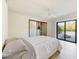 Bright bedroom featuring access to an outdoor patio and closet with sleek sliding doors at 5801 E Surrey Dr, Cave Creek, AZ 85331
