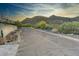 Street view featuring desert landscape, native plants, and views of the mountains at 5801 E Surrey Dr, Cave Creek, AZ 85331