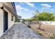 Paver walkway leading to home, xeriscaping, desert plants, and a glimpse of the mountains at 5801 E Surrey Dr, Cave Creek, AZ 85331
