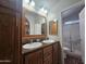 Bathroom with double vanity sinks and a walk in shower, offering style and functionality at 650 N Hawes Rd # 3604, Mesa, AZ 85207