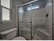 Updated bathroom features a walk-in shower with a glass door and white tile at 650 N Hawes Rd # 3604, Mesa, AZ 85207