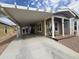 Charming home exterior with covered parking, porch, and desert landscaping at 650 N Hawes Rd # 3604, Mesa, AZ 85207