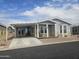 Charming home featuring covered parking, landscaped yard and a welcoming front porch at 650 N Hawes Rd # 3604, Mesa, AZ 85207