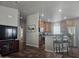 A view of the kitchen featuring wood cabinets, stainless steel appliances, and an island at 650 N Hawes Rd # 3604, Mesa, AZ 85207