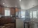 Open-concept kitchen boasting stainless steel appliances and a dining area with natural light at 650 N Hawes Rd # 3604, Mesa, AZ 85207
