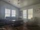 Comfortable living room featuring a ceiling fan and multiple windows with natural light at 650 N Hawes Rd # 3604, Mesa, AZ 85207