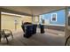 The covered patio features seating, trash cans, and a grill at 650 N Hawes Rd # 3604, Mesa, AZ 85207