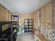 The storage room has wood walls, shelves, lighting, and a rug on the floor at 650 N Hawes Rd # 3604, Mesa, AZ 85207