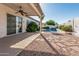 Beautiful backyard oasis with covered patio, pool and mature landscaping at 7130 E Laguna Azul Ave, Mesa, AZ 85209