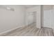 The bedroom boasts wood-style floors and a closet with sliding mirror doors at 7130 E Laguna Azul Ave, Mesa, AZ 85209