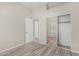 This bedroom features wood-style floors and a closet with mirrored sliding doors at 7130 E Laguna Azul Ave, Mesa, AZ 85209