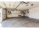 Spacious garage with ample storage, work area, and access to the home at 7130 E Laguna Azul Ave, Mesa, AZ 85209