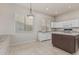 Open kitchen featuring granite countertops, modern appliances, and neutral tiled flooring at 7130 E Laguna Azul Ave, Mesa, AZ 85209