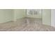 Open living room area with wood flooring and large windows at 7130 E Laguna Azul Ave, Mesa, AZ 85209