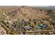An aerial view of the community's amenities, featuring a pool, tennis courts, and desert surroundings at 7413 E Russet Sky Dr, Scottsdale, AZ 85266