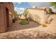 Desert backyard featuring drought-tolerant landscaping and a brick-paved patio and walkway at 7413 E Russet Sky Dr, Scottsdale, AZ 85266