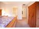 Comfortable bedroom with a large closet, spacious bed with floral comforter, and carpet floors at 7413 E Russet Sky Dr, Scottsdale, AZ 85266