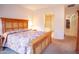 Comfortable bedroom featuring a spacious bed with a floral comforter and carpet floors at 7413 E Russet Sky Dr, Scottsdale, AZ 85266