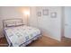 Bedroom with neutral walls, carpeted floors, quilt bed and decorative wall art at 7413 E Russet Sky Dr, Scottsdale, AZ 85266