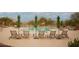 Relax by the community pool with plenty of lounge chairs and desert landscaping at 7413 E Russet Sky Dr, Scottsdale, AZ 85266