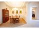 Formal dining room illuminated by elegant chandelier and featuring decorative archways and stylish furnishings at 7413 E Russet Sky Dr, Scottsdale, AZ 85266