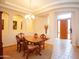 Well-lit dining room featuring a wooden table, chandelier lighting, and an inviting atmosphere for gatherings at 7413 E Russet Sky Dr, Scottsdale, AZ 85266