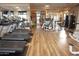 Bright gym with rows of treadmills and weight machines for residents to keep fit at 7413 E Russet Sky Dr, Scottsdale, AZ 85266
