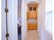 Hallway featuring built-in cabinets and natural light from a nearby window at 7413 E Russet Sky Dr, Scottsdale, AZ 85266