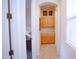 Hallway showcasing tile flooring, neutral walls and wooden cabinets at 7413 E Russet Sky Dr, Scottsdale, AZ 85266