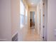 Hallway with neutral tile floors leading to additional rooms, natural light at 7413 E Russet Sky Dr, Scottsdale, AZ 85266
