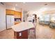 Open kitchen with island, breakfast bar, and seamless flow to the living area at 7413 E Russet Sky Dr, Scottsdale, AZ 85266