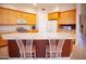 Spacious kitchen with stainless steel appliances, large center island, and breakfast bar at 7413 E Russet Sky Dr, Scottsdale, AZ 85266