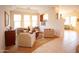 Bright living room featuring large windows, tray ceilings, and comfortable seating arrangements at 7413 E Russet Sky Dr, Scottsdale, AZ 85266
