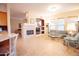 Bright living room with tile floor, fireplace, and large windows for natural light at 7413 E Russet Sky Dr, Scottsdale, AZ 85266