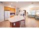 Open floor plan showcasing the kitchen with island and a cozy living room area at 7413 E Russet Sky Dr, Scottsdale, AZ 85266