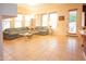 Spacious living room with tile floors, large sectional sofa, and lots of natural light at 7413 E Russet Sky Dr, Scottsdale, AZ 85266