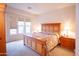 Spacious main bedroom with a large window and beautiful lamps on each nightstand at 7413 E Russet Sky Dr, Scottsdale, AZ 85266