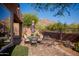 Patio with brick flooring, outdoor seating area, desert landscaping, and mountain views at 7413 E Russet Sky Dr, Scottsdale, AZ 85266