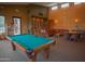 Inviting recreation room featuring a pool table, comfortable seating, and a library, perfect for leisure activities at 7413 E Russet Sky Dr, Scottsdale, AZ 85266