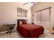 Cozy bedroom featuring a comfortable bed and personal touches at 7939 E Stonecliff Cir, Mesa, AZ 85207