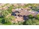 Aerial view of the community clubhouse with beautiful Southwestern architecture and lush landscaping at 7939 E Stonecliff Cir, Mesa, AZ 85207