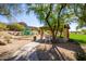 View of a shady park featuring a playground and ramada with seating in a well-maintained community space at 7939 E Stonecliff Cir, Mesa, AZ 85207