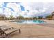 Large community pool with lounge chairs perfect for relaxation and summer fun at 7939 E Stonecliff Cir, Mesa, AZ 85207