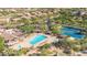 Aerial view showcasing community pool, spa, and tennis courts, perfect for recreation and relaxation at 7939 E Stonecliff Cir, Mesa, AZ 85207
