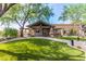 Beautiful community center entrance with lush landscaping and welcoming walkway at 7939 E Stonecliff Cir, Mesa, AZ 85207